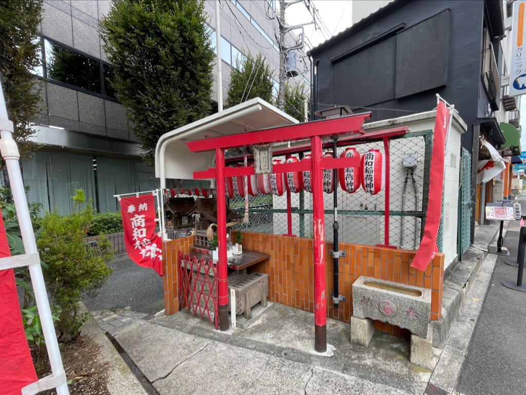 A very small Inari jinja, with a red torii, but a sanctuary small enough to pick up (in theory).